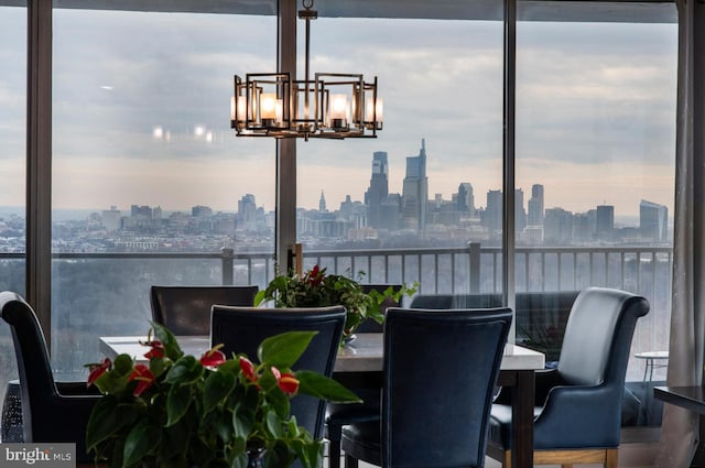 3900 Ford Rd Unit 21E & 20E, Philadelphia, PA 19131 - dining space featuring a skyline view and a chandelier