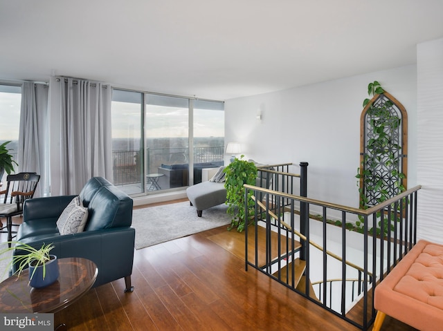 3900 Ford Rd Unit 21E & 20E, Philadelphia, PA 19131 - living area featuring wood finished floors, plenty of natural light, and expansive windows