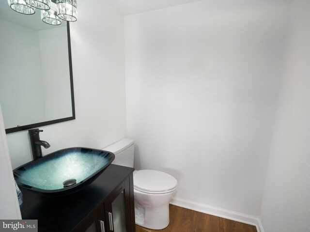 3900 Ford Rd Unit 21E & 20E, Philadelphia, PA 19131 - half bath with wood finished floors, baseboards, toilet, and vanity