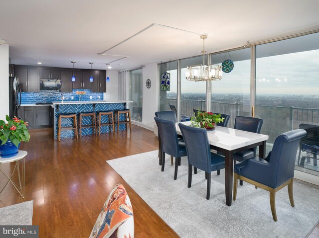 3900 Ford Rd Unit 21E & 20E, Philadelphia, PA 19131 - dining room with wood finished floors, a chandelier, and attic access