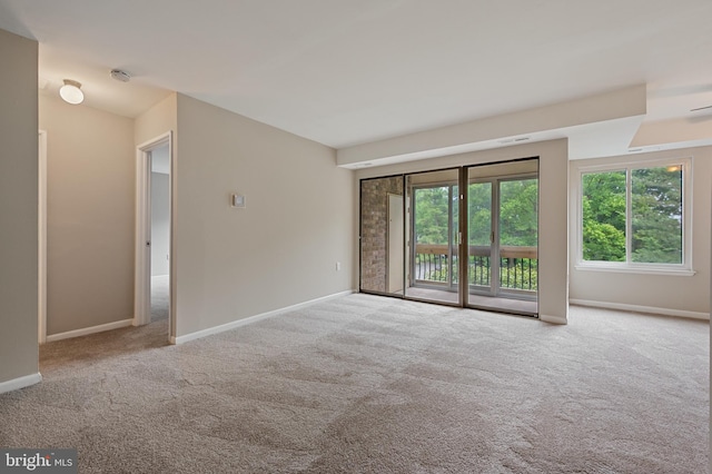 10528 Cross Fox Ln Unit D-2, Columbia, MD 21044 - carpeted empty room featuring healthy amount of natural light and baseboards