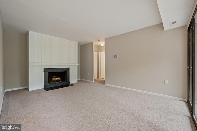 10528 Cross Fox Ln Unit D-2, Columbia, MD 21044 - unfurnished living room featuring carpet, a large fireplace, and baseboards
