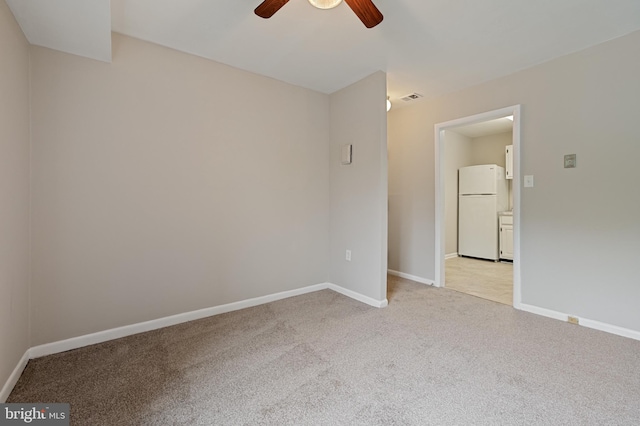 10528 Cross Fox Ln Unit D-2, Columbia, MD 21044 - spare room with a ceiling fan, light carpet, and baseboards