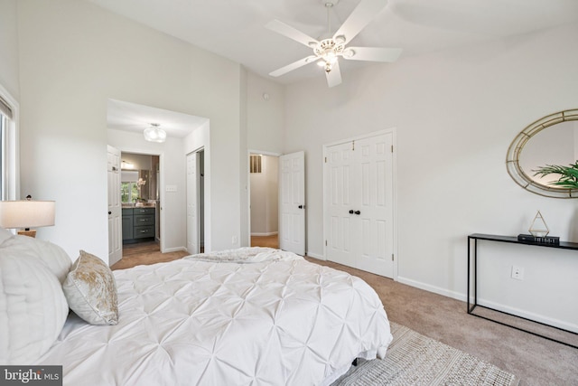 5071 Columbia Rd, Columbia, MD 21044 - bedroom featuring a high ceiling, carpet, baseboards, connected bathroom, and two closets