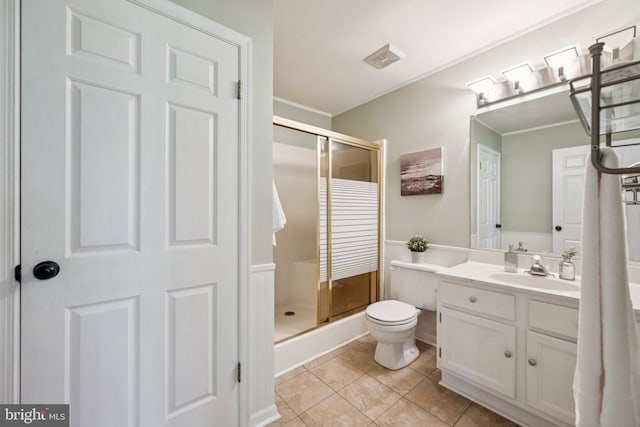 5071 Columbia Rd, Columbia, MD 21044 - full bathroom featuring a stall shower, vanity, toilet, crown molding, and tile patterned floors