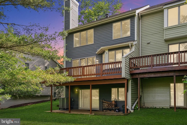 5071 Columbia Rd, Columbia, MD 21044 - rear view of property featuring a wooden deck, a chimney, a yard, and central air condition unit