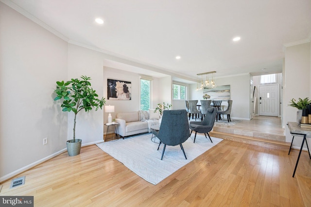 5071 Columbia Rd, Columbia, MD 21044 - living area with light wood-style flooring, ornamental molding, baseboards, recessed lighting, and a chandelier