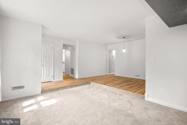 7556 S Arbory Ln Unit 382, Laurel, MD 20707 - spare room with carpet floors and wood finished floors