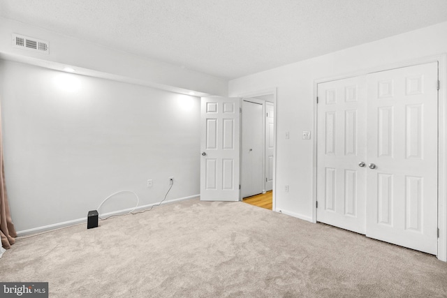 7556 S Arbory Ln Unit 382, Laurel, MD 20707 - unfurnished bedroom with carpet flooring, a closet, and a textured ceiling