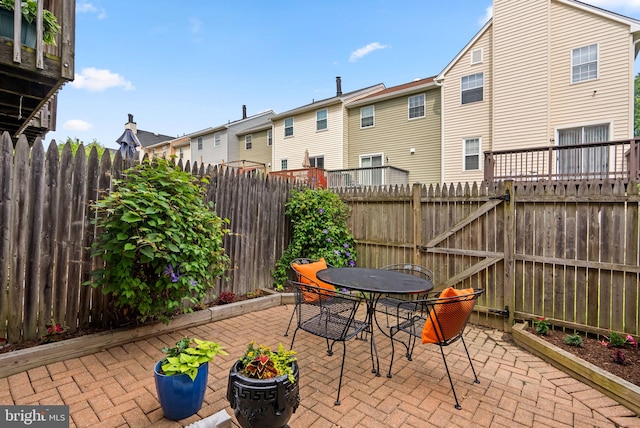 7556 S Arbory Ln Unit 382, Laurel, MD 20707 - fenced backyard featuring a patio, outdoor dining space, and a residential view