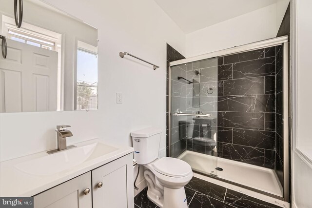 3711 Spaulding Ave, Baltimore, MD 21215 - bathroom with marble finish flooring, toilet, a stall shower, and vanity