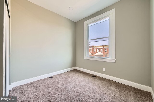 3711 Spaulding Ave, Baltimore, MD 21215 - carpeted empty room with baseboards