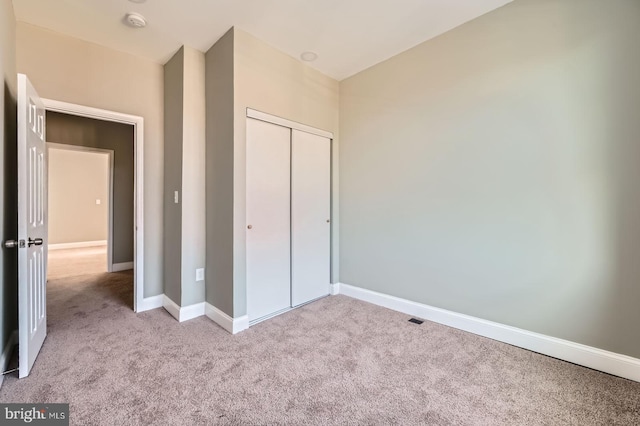 3711 Spaulding Ave, Baltimore, MD 21215 - unfurnished bedroom with carpet, a closet, baseboards, and vaulted ceiling