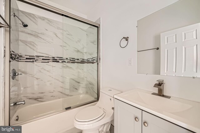 3711 Spaulding Ave, Baltimore, MD 21215 - bathroom featuring toilet, vanity, and shower / bath combination with glass door