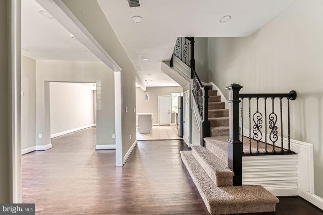 3711 Spaulding Ave, Baltimore, MD 21215 - foyer entrance with wood finished floors, stairs, baseboards, and recessed lighting