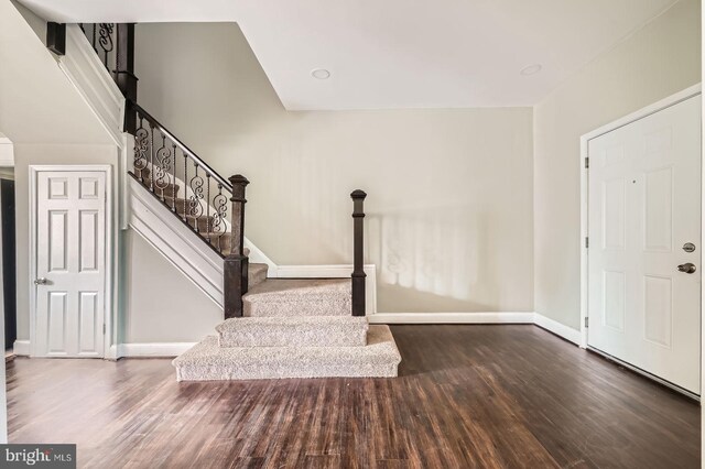 3711 Spaulding Ave, Baltimore, MD 21215 - foyer entrance with wood finished floors, stairway, and baseboards