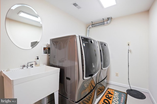 4604 Park Rd, Alexandria, VA 22312 - laundry room with separate washer and dryer and baseboards