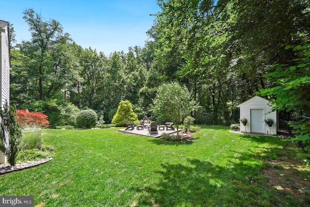 4604 Park Rd, Alexandria, VA 22312 - view of grassy yard with a fire pit, a patio area, and a storage unit