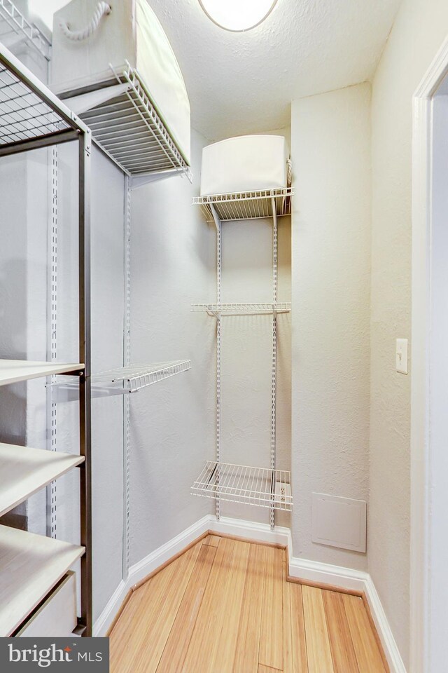 1441 Euclid St NW Unit 105, Washington, DC 20009 - walk in closet with wood finished floors