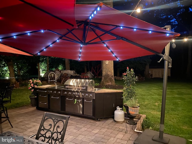 155 Ridge Rd, Southampton, NJ 08088 - patio at twilight with area for grilling, a patio area, and a yard