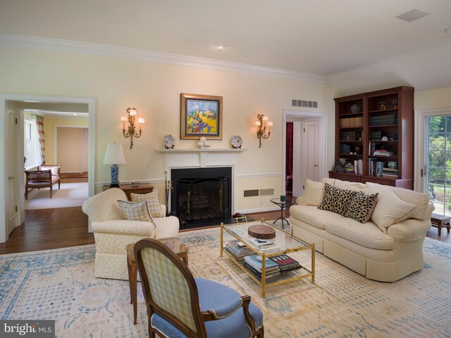 825 Parkes Run Ln, Villanova, PA 19085 - living area featuring a fireplace with flush hearth, crown molding, and wood finished floors