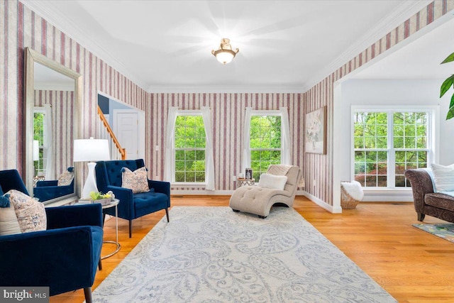 10840 Wolfsville Rd, Myersville, MD 21773 - living area with wallpapered walls, crown molding, wood finished floors, and baseboards
