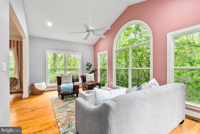 10840 Wolfsville Rd, Myersville, MD 21773 - living room featuring light wood finished floors, ceiling fan, baseboards, and high vaulted ceiling