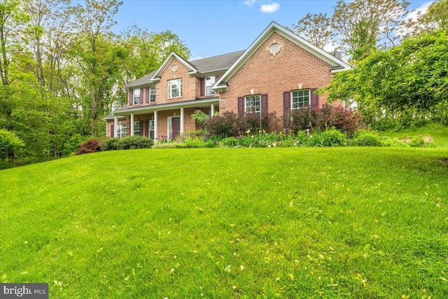 10840 Wolfsville Rd, Myersville, MD 21773 - view of front of home with brick siding and a front lawn