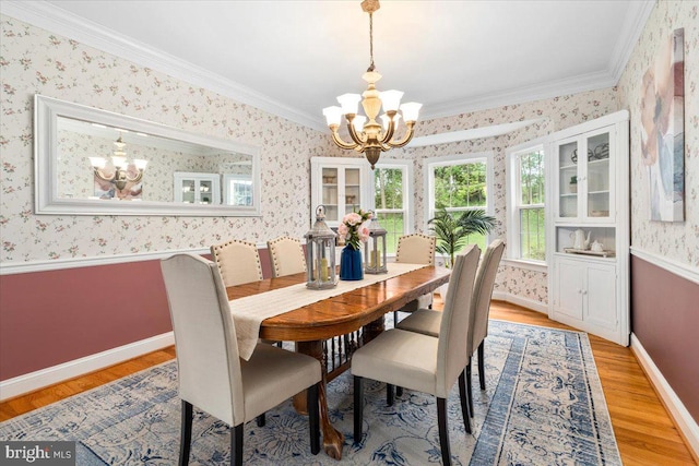10840 Wolfsville Rd, Myersville, MD 21773 - dining area with a chandelier, wallpapered walls, baseboards, light wood finished floors, and ornamental molding