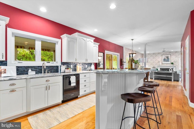10840 Wolfsville Rd, Myersville, MD 21773 - kitchen with black dishwasher, plenty of natural light, white cabinetry, a sink, and recessed lighting