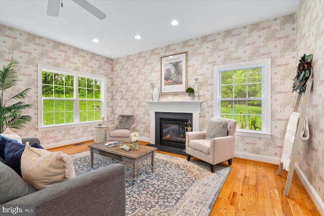 10840 Wolfsville Rd, Myersville, MD 21773 - living room with wood finished floors, baseboards, plenty of natural light, recessed lighting, and a fireplace with flush hearth