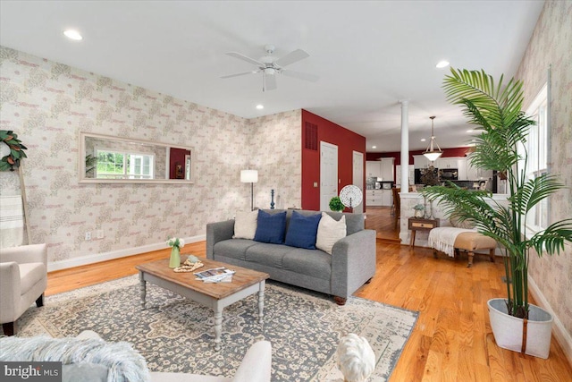 10840 Wolfsville Rd, Myersville, MD 21773 - living area featuring wood finished floors, ceiling fan, wallpapered walls, recessed lighting, and baseboards