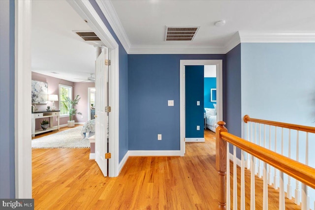 10840 Wolfsville Rd, Myersville, MD 21773 - corridor with light wood finished floors, baseboards, crown molding, and an upstairs landing