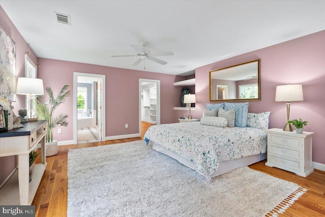 10840 Wolfsville Rd, Myersville, MD 21773 - bedroom featuring wood finished floors, baseboards, ensuite bathroom, and a ceiling fan