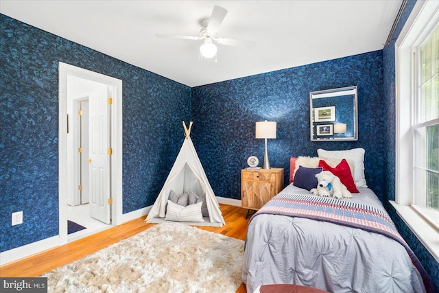 10840 Wolfsville Rd, Myersville, MD 21773 - bedroom with wood finished floors, baseboards, and a ceiling fan