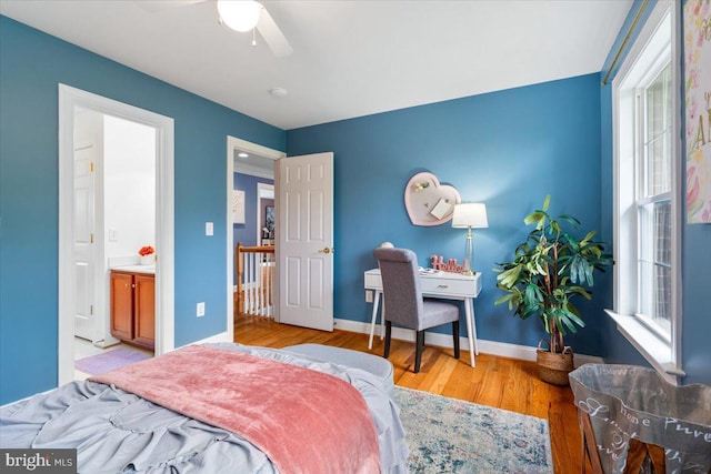 10840 Wolfsville Rd, Myersville, MD 21773 - bedroom with wood finished floors, ceiling fan, baseboards, and ensuite bath