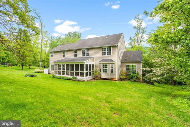 10840 Wolfsville Rd, Myersville, MD 21773 - rear view of house featuring a sunroom, a yard, and a shingled roof