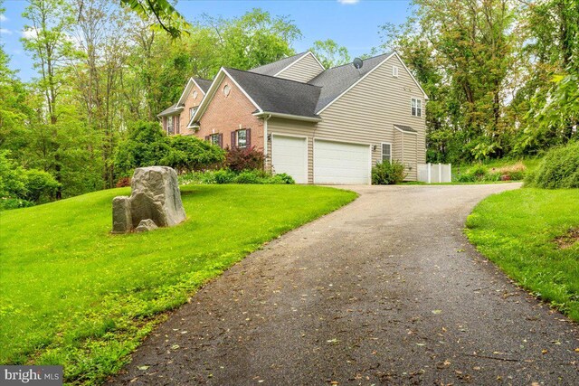 10840 Wolfsville Rd, Myersville, MD 21773 - view of property exterior featuring a garage, a lawn, driveway, and roof with shingles