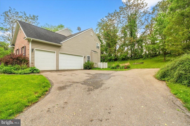 10840 Wolfsville Rd, Myersville, MD 21773 - view of property exterior featuring driveway, a garage, a lawn, and roof with shingles
