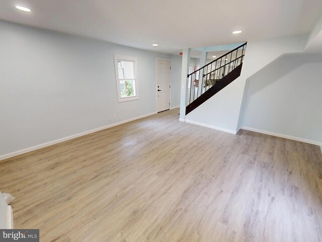 6 W Griffith St, Penns Grove, NJ 08069 - unfurnished living room featuring stairs, baseboards, recessed lighting, and light wood-style floors