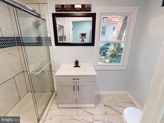 6 W Griffith St, Penns Grove, NJ 08069 - bathroom with marble look tile flooring, vanity, baseboards, a shower stall, and toilet