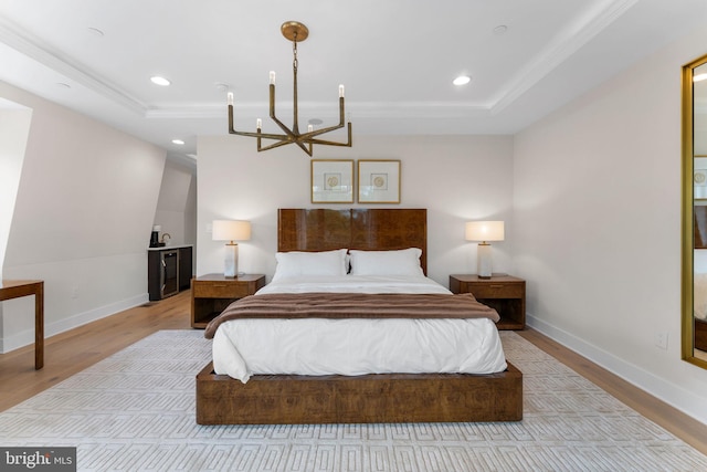 1632 Chain Bridge Rd, Mclean, VA 22101 - bedroom with a chandelier, a tray ceiling, wood finished floors, ornamental molding, and baseboards