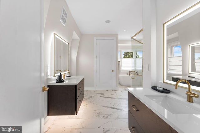 1632 Chain Bridge Rd, Mclean, VA 22101 - bathroom with marble finish flooring, plenty of natural light, two vanities, and a soaking tub