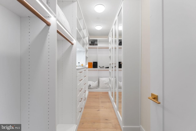 1632 Chain Bridge Rd, Mclean, VA 22101 - walk in closet with light wood-type flooring