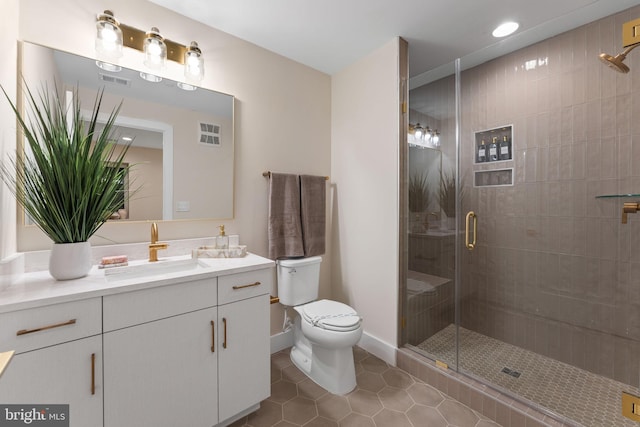1632 Chain Bridge Rd, Mclean, VA 22101 - bathroom featuring vanity, toilet, tile patterned floors, a stall shower, and recessed lighting