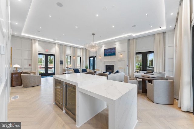 1632 Chain Bridge Rd, Mclean, VA 22101 - kitchen featuring french doors, open floor plan, beverage cooler, a raised ceiling, and recessed lighting
