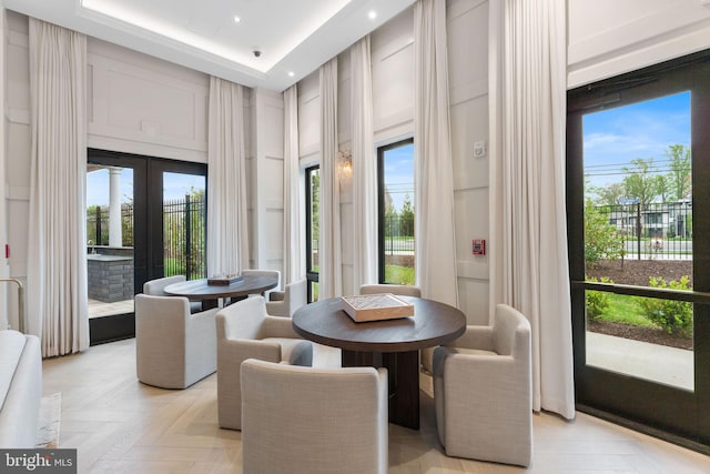 1632 Chain Bridge Rd, Mclean, VA 22101 - dining space featuring a decorative wall, french doors, plenty of natural light, recessed lighting, and a towering ceiling