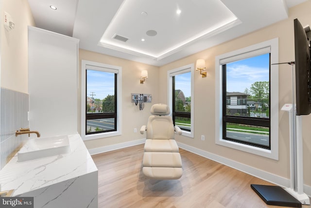 1632 Chain Bridge Rd, Mclean, VA 22101 - living area featuring a tray ceiling, healthy amount of natural light, light wood-style floors, baseboards, and recessed lighting