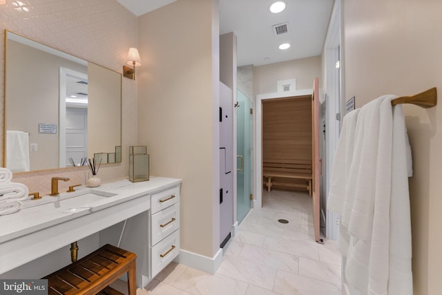 1632 Chain Bridge Rd, Mclean, VA 22101 - bathroom with vanity, marble finish floors, recessed lighting, and baseboards