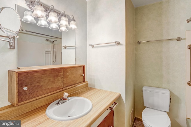 2306 Marline Ct, Woodbridge, VA 22192 - bathroom featuring vanity, toilet, a shower, and baseboards